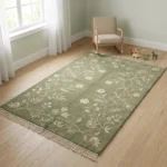 Sage green hand knotted wool rug with floral vine design handcrafted in Bhadohi India