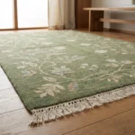 Sage green hand knotted wool rug with floral vine design handcrafted in Bhadohi India