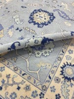 blue Oushak area rug in living room setting