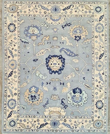 blue Oushak rug in soft ivory with traditional floral design